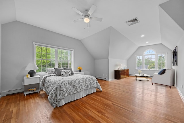 56 Londonderry Ln, Somers, NY 10589 - bedroom featuring a baseboard heating unit, lofted ceiling, wood finished floors, baseboard heating, and a ceiling fan
