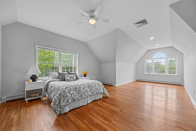56 Londonderry Ln, Somers, NY 10589 - bedroom with a baseboard heating unit, baseboard heating, vaulted ceiling, wood finished floors, and ceiling fan