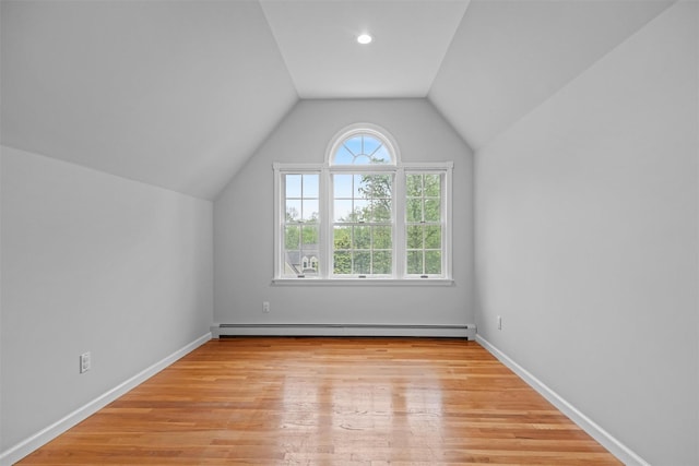 56 Londonderry Ln, Somers, NY 10589 - bonus room with a baseboard heating unit, vaulted ceiling, light wood-style flooring, and baseboards