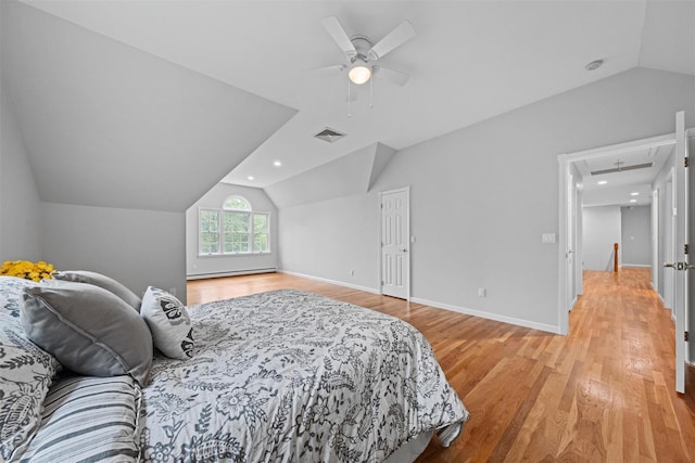 56 Londonderry Ln, Somers, NY 10589 - bedroom featuring vaulted ceiling, light wood-type flooring, a baseboard heating unit, a ceiling fan, and attic access