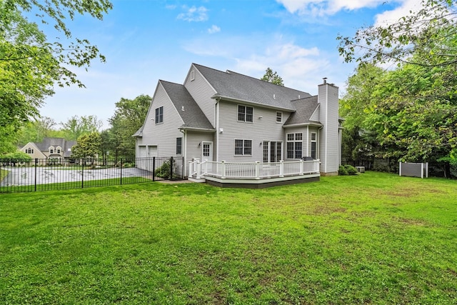 56 Londonderry Ln, Somers, NY 10589 - rear view of property featuring a chimney, a deck, roof with shingles, a garage, and driveway