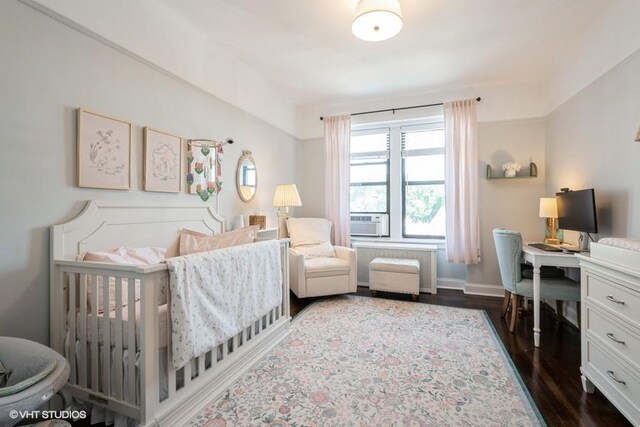 31 Pondfield Rd W Unit 68, Bronxville, NY 10708 - bedroom with dark wood finished floors, a desk, baseboards, and a nursery area