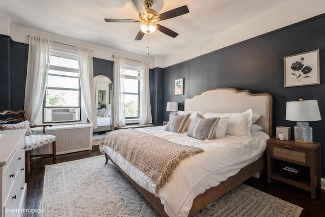 31 Pondfield Rd W Unit 68, Bronxville, NY 10708 - bedroom with radiator heating unit, dark wood finished floors, cooling unit, and ceiling fan