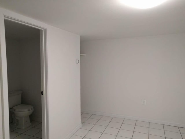 empty room with light tile patterned floors