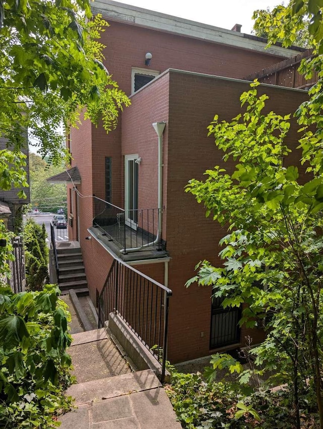 5465 Sylvan Ave, Bronx, NY 10471 - back of property featuring stairway and brick siding