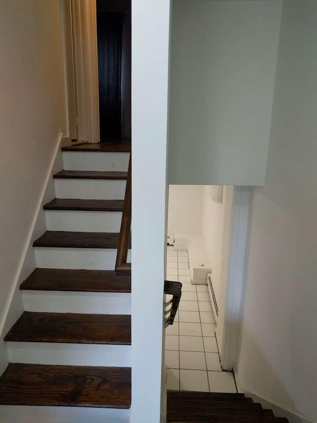5465 Sylvan Ave, Bronx, NY 10471 - stairway featuring baseboard heating and tile patterned floors