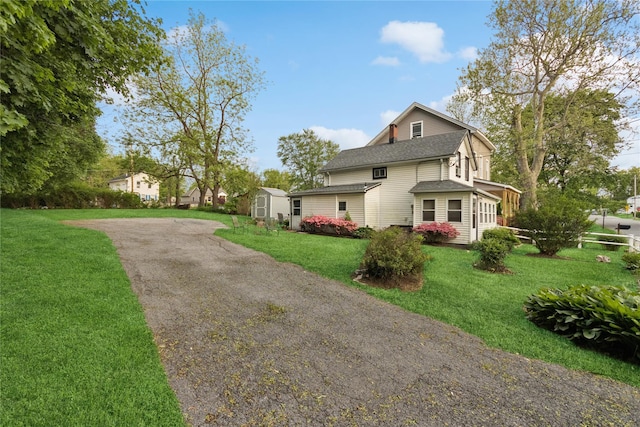 35 Fallkill Ave, Poughkeepsie, NY 12601 - view of home's exterior featuring a lawn, a shingled roof, and driveway