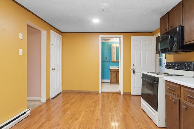 35 Fallkill Ave, Poughkeepsie, NY 12601 - kitchen featuring white electric range, black microwave, baseboard heating, and light wood-type flooring