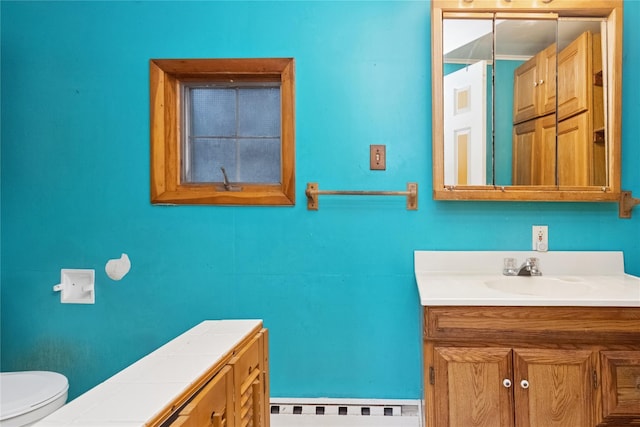 35 Fallkill Ave, Poughkeepsie, NY 12601 - bathroom with a baseboard heating unit, vanity, and toilet
