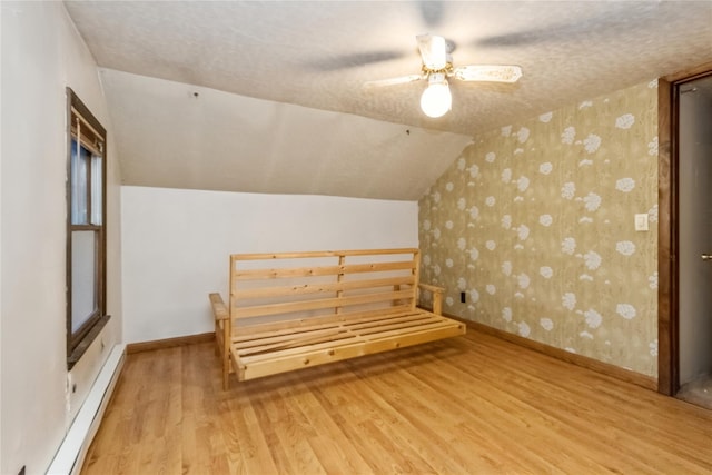 35 Fallkill Ave, Poughkeepsie, NY 12601 - additional living space featuring wallpapered walls, wood finished floors, a baseboard radiator, baseboards, and ceiling fan