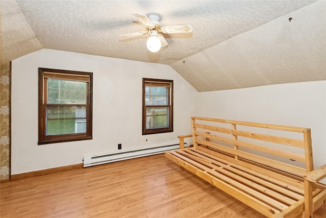 35 Fallkill Ave, Poughkeepsie, NY 12601 - bonus room with a baseboard heating unit, lofted ceiling, wood finished floors, a textured ceiling, and plenty of natural light