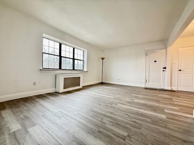 78-16 147th St # # 3C, Flushing, NY 11367 - unfurnished living room with wood finished floors and baseboards