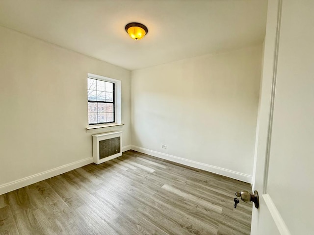 78-16 147th St # # 3C, Flushing, NY 11367 - unfurnished room featuring wood finished floors and baseboards