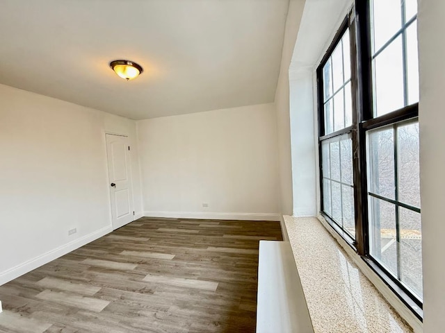 78-16 147th St # # 3C, Flushing, NY 11367 - unfurnished room featuring healthy amount of natural light, wood finished floors, and baseboards
