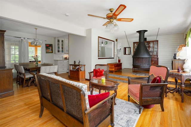 68 Forest Dr, Poughquag, NY 12570 - living area featuring light wood finished floors, a wood stove, and a ceiling fan