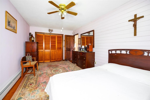 68 Forest Dr, Poughquag, NY 12570 - bedroom with a baseboard heating unit, light wood finished floors, a closet, ceiling fan, and baseboards