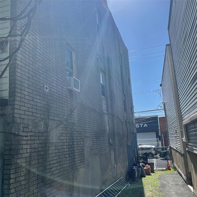 361-363 Broadway, Staten Island, NY 10310 - view of property exterior with fence and brick siding