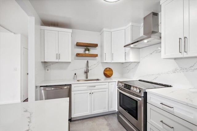 50 Columbus Ave Unit 605, Tuckahoe, NY 10707 - kitchen featuring wall chimney range hood, a sink, appliances with stainless steel finishes, open shelves, and white cabinetry