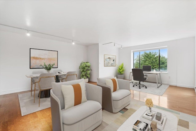 50 Columbus Ave Unit 605, Tuckahoe, NY 10707 - living room featuring track lighting, a desk, light wood-type flooring, and baseboards