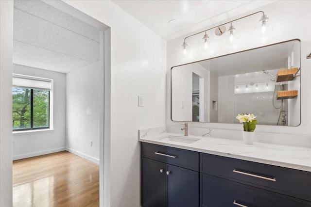 50 Columbus Ave Unit 605, Tuckahoe, NY 10707 - full bathroom featuring vanity, wood finished floors, baseboards, and a shower