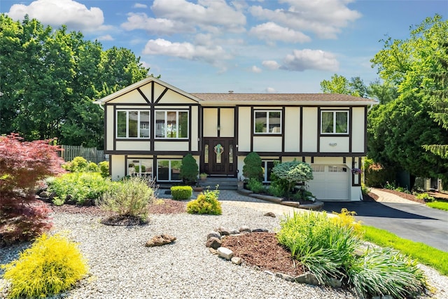 8 Skinner Ct, Tomkins Cove, NY 10986 - view of front of house with stucco siding, driveway, and an attached garage