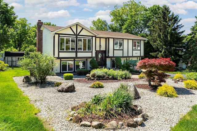 8 Skinner Ct, Tomkins Cove, NY 10986 - view of front of home with a chimney, stucco siding, a front lawn, and an outbuilding
