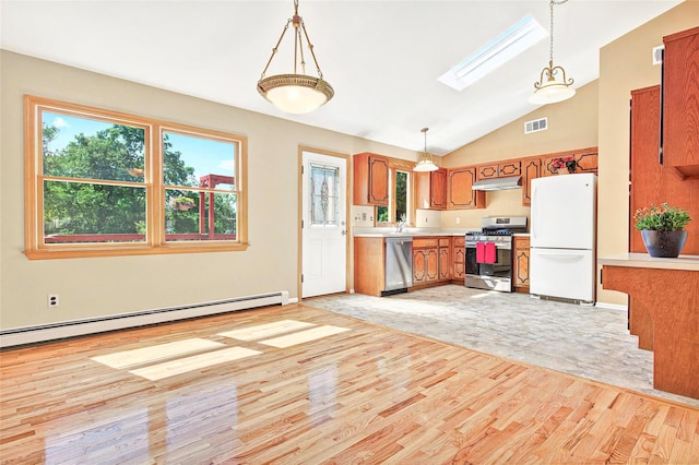 8 Skinner Ct, Tomkins Cove, NY 10986 - kitchen featuring appliances with stainless steel finishes, light wood-style floors, brown cabinets, baseboard heating, and a skylight