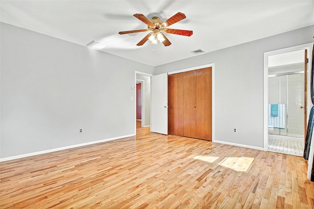 8 Skinner Ct, Tomkins Cove, NY 10986 - unfurnished bedroom with light wood-type flooring, baseboards, a closet, ensuite bath, and a ceiling fan