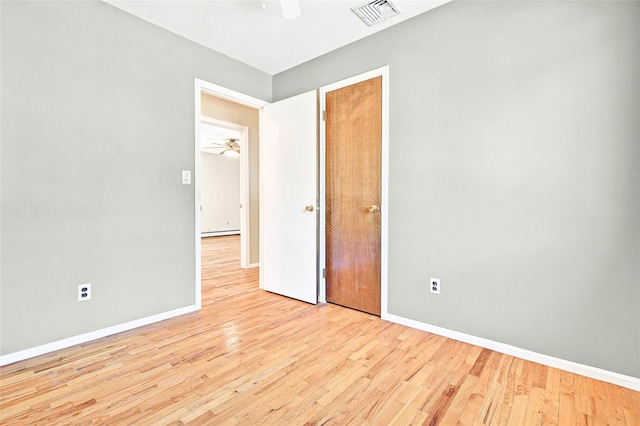8 Skinner Ct, Tomkins Cove, NY 10986 - unfurnished bedroom with wood finished floors, baseboards, a baseboard radiator, and ceiling fan