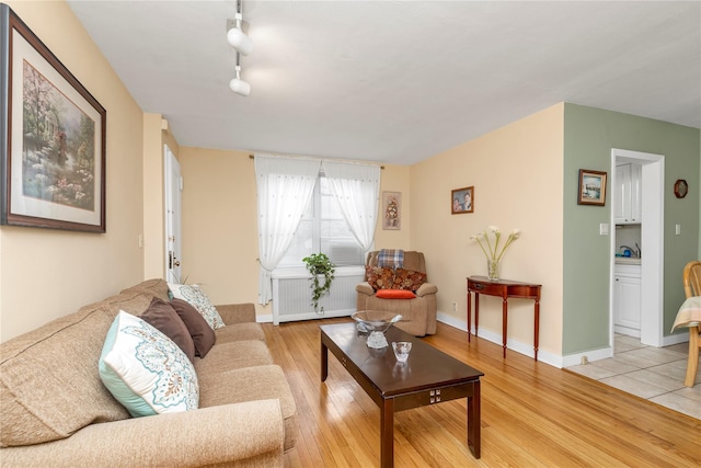 204-08 35th Ave Unit 247, Bayside, NY 11361 - living room featuring light wood-type flooring and radiator