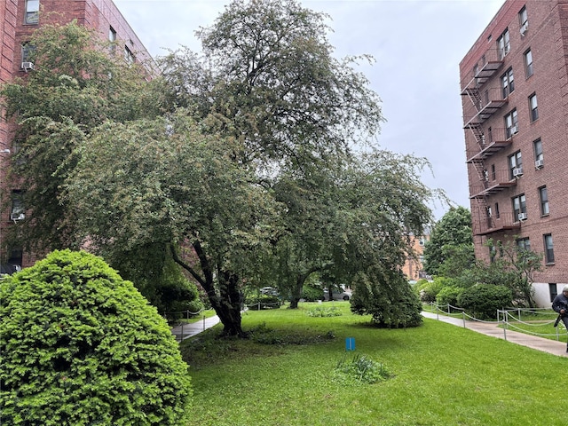 144-44 38th Ave Unit 6G, Flushing, NY 11354 - view of community featuring a lawn