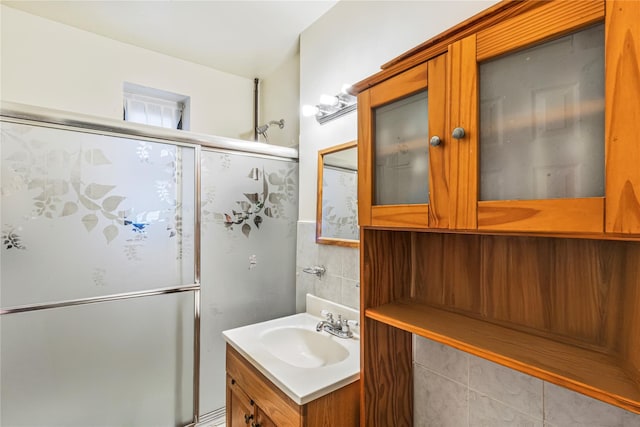 144-44 38th Ave Unit 6G, Flushing, NY 11354 - full bath with a shower stall, vanity, tile walls, and wainscoting