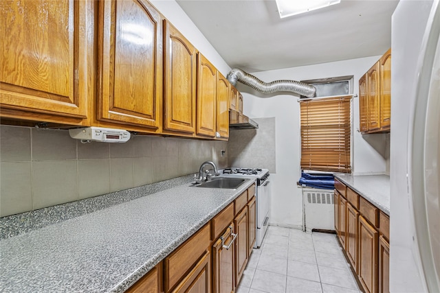 144-44 38th Ave Unit 6G, Flushing, NY 11354 - kitchen with white appliances, a sink, backsplash, brown cabinets, and radiator heating unit