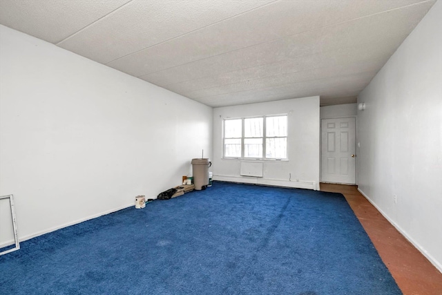 154-04 107th Ave, Jamaica, NY 11433 - carpeted empty room featuring baseboard heating and baseboards