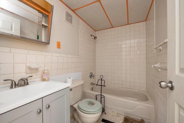 154-04 107th Ave, Jamaica, NY 11433 - full bath with bathtub / shower combination, toilet, vanity, tile walls, and tile patterned floors