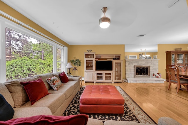 living room featuring wood finished floors and a fireplace