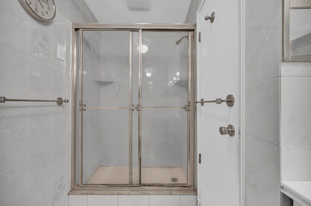 bathroom featuring a shower stall