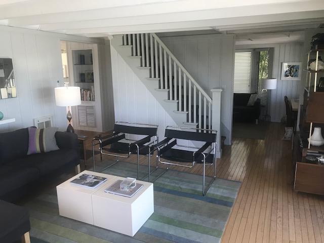 209 Bayview Walk, Cherry Grove, NY 11782 - living area with wood-type flooring and stairway