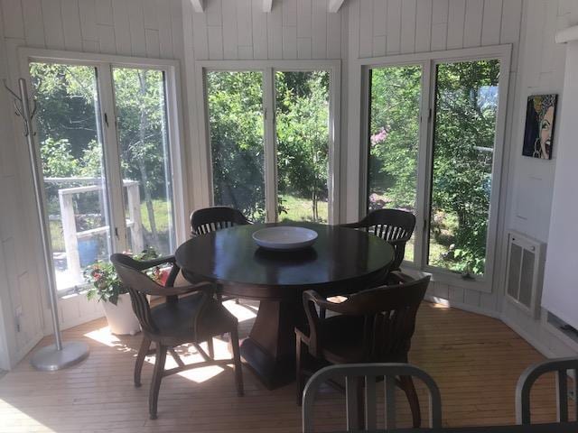 209 Bayview Walk, Cherry Grove, NY 11782 - sunroom with wood finished floors, a deck, and wooden walls