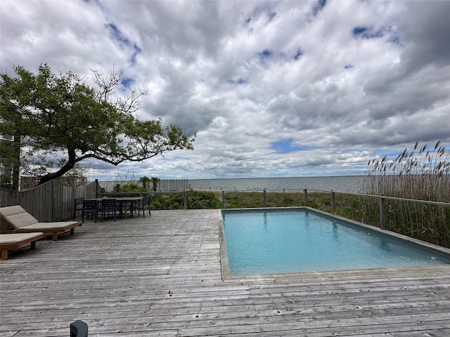 209 Bayview Walk, Cherry Grove, NY 11782 - view of swimming pool with a wooden deck and outdoor dining area