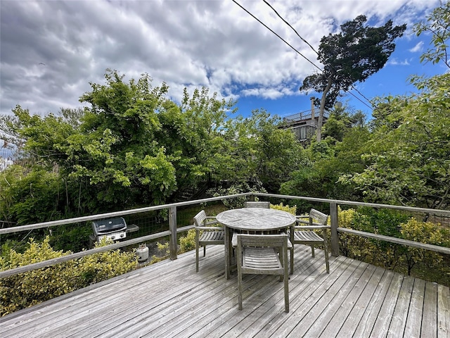 209 Bayview Walk, Cherry Grove, NY 11782 - wooden deck with outdoor dining space and area for grilling