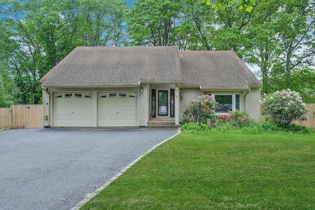 12 Grand Canyon Ln, Coram, NY 11727 - view of front of property with an attached garage, a shingled roof, and asphalt driveway