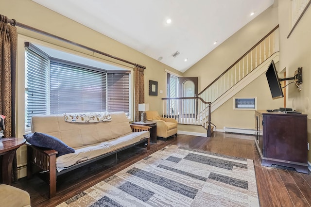 12 Grand Canyon Ln, Coram, NY 11727 - living room with dark wood-style flooring, a baseboard heating unit, vaulted ceiling, stairs, and baseboards