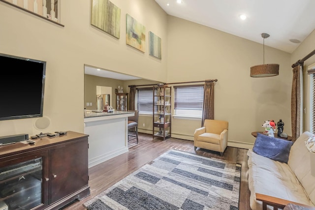 12 Grand Canyon Ln, Coram, NY 11727 - living room with wood finished floors, high vaulted ceiling, baseboard heating, recessed lighting, and baseboards