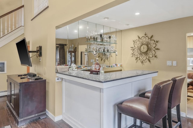 12 Grand Canyon Ln, Coram, NY 11727 - indoor dry bar with dark wood finished floors, baseboards, and recessed lighting