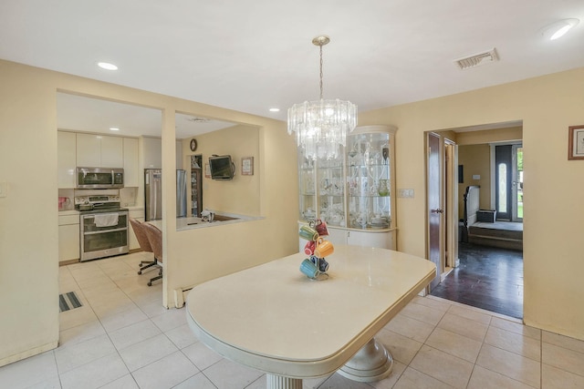 12 Grand Canyon Ln, Coram, NY 11727 - dining room with light tile patterned floors, a chandelier, and recessed lighting