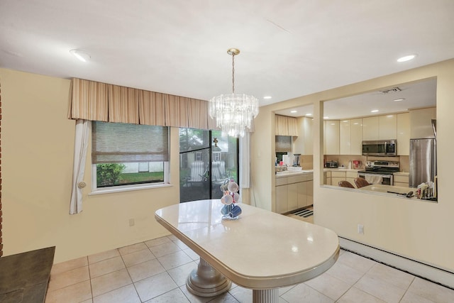 12 Grand Canyon Ln, Coram, NY 11727 - dining room with a chandelier, light tile patterned flooring, and recessed lighting