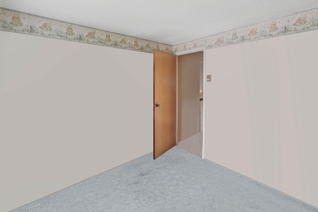 12 Grand Canyon Ln, Coram, NY 11727 - carpeted empty room featuring wallpapered walls