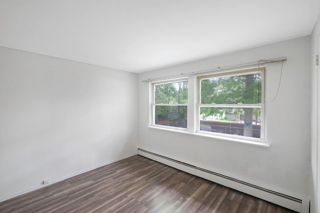 12 Grand Canyon Ln, Coram, NY 11727 - spare room with baseboard heating and wood finished floors