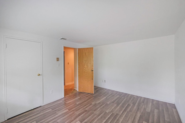 12 Grand Canyon Ln, Coram, NY 11727 - spare room with wood finished floors